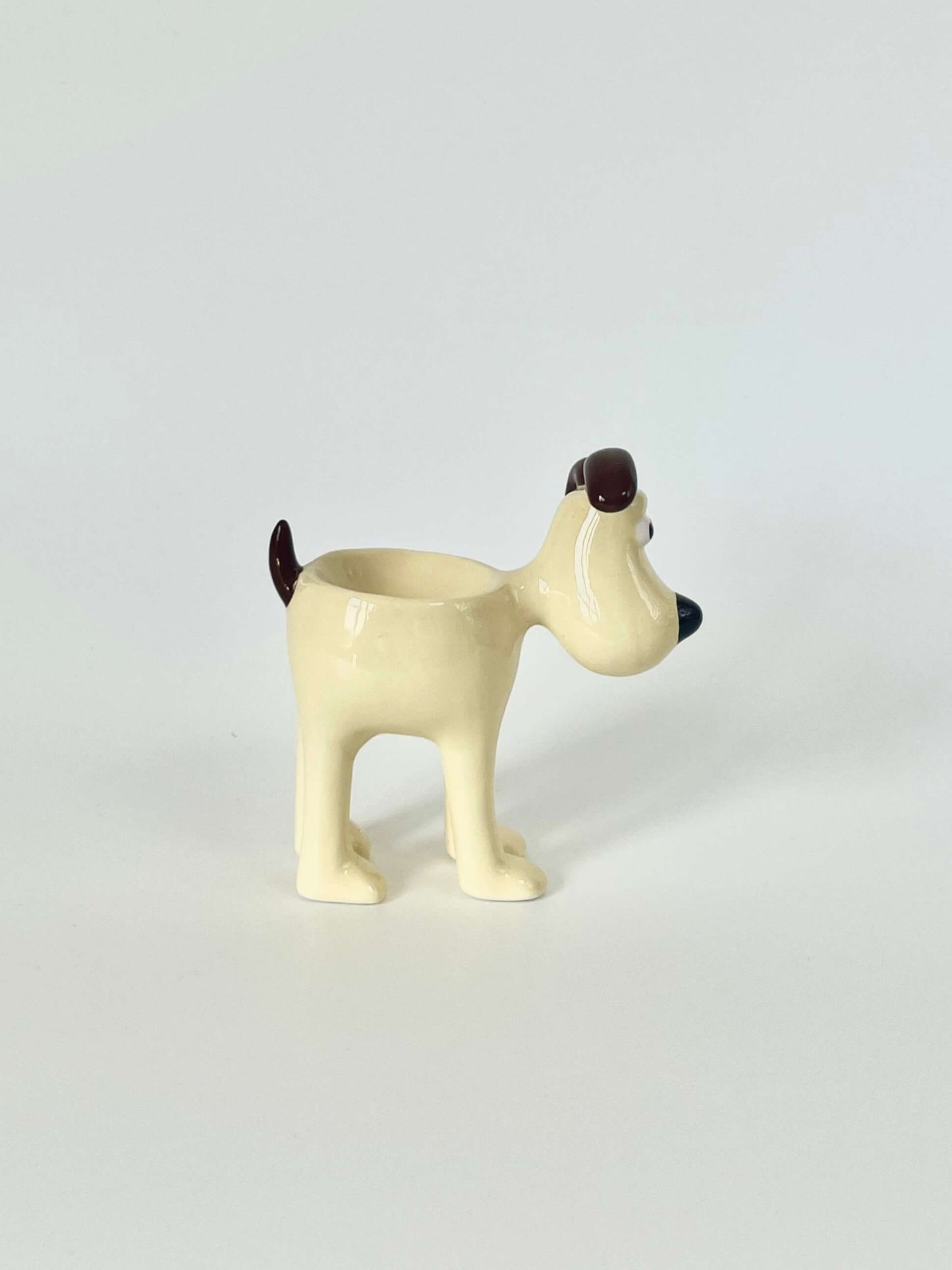 Stella Egg Cup. A cute Wallace and Gromit egg holder. A cute ceramic egg holder. In the shape of a pet dog for your table. Home décor piece and tableware set.