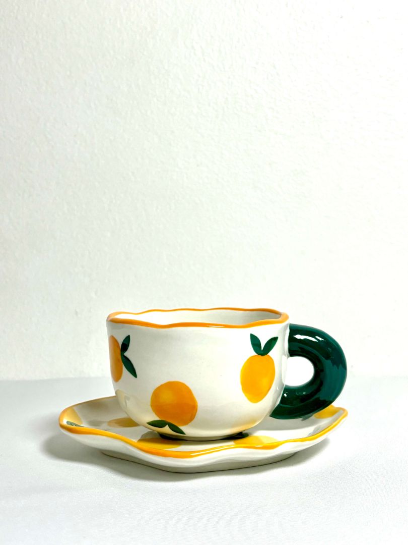 Miranda Tea Cup. The cutest tea set with a cup and plate combination. Tangerine design with green handle. Aesthetic ceramic tea set. 