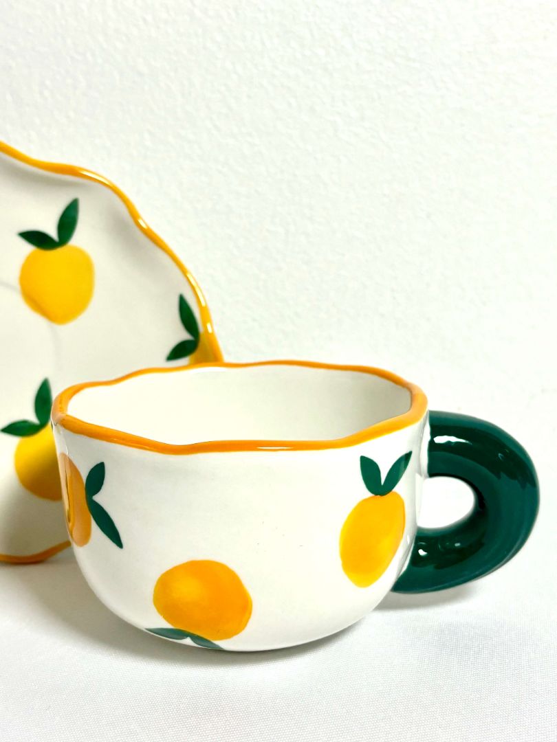 Miranda Tea Cup. The cutest tea set with a cup and plate combination. Tangerine design with green handle. Aesthetic ceramic tea set. 
